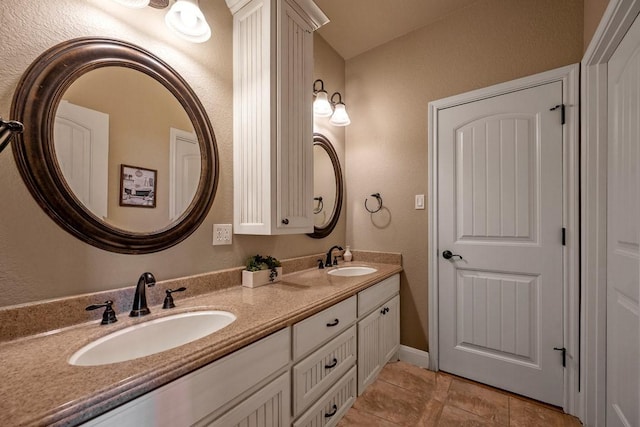 209 Chrissa Dr, Pottsboro, TX 75076 - full bath featuring double vanity, tile patterned floors, and a textured wall
