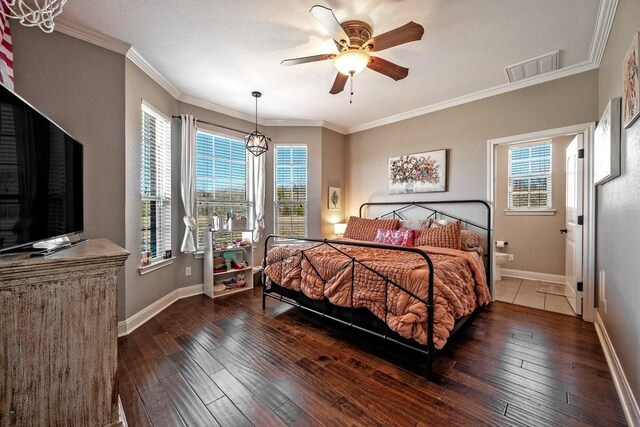 209 Chrissa Dr, Pottsboro, TX 75076 - bedroom with dark wood-style floors, baseboards, crown molding, ceiling fan, and connected bathroom