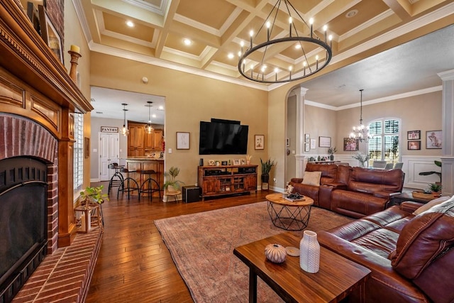 209 Chrissa Dr, Pottsboro, TX 75076 - living area featuring a chandelier, crown molding, coffered ceiling, dark wood-type flooring, and a fireplace