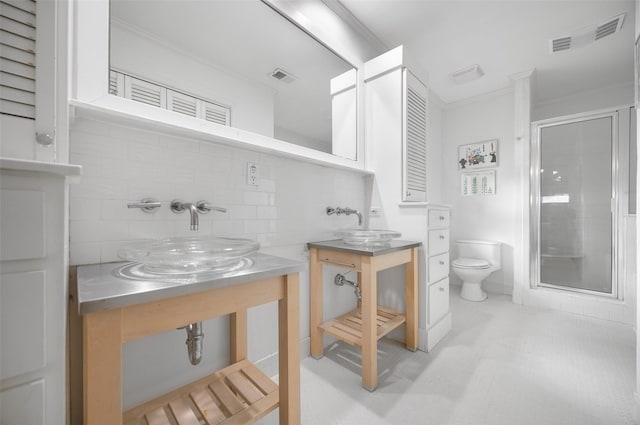 bathroom with toilet, visible vents, ornamental molding, decorative backsplash, and a stall shower