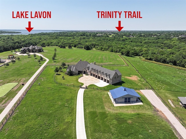 drone / aerial view featuring a rural view and a wooded view