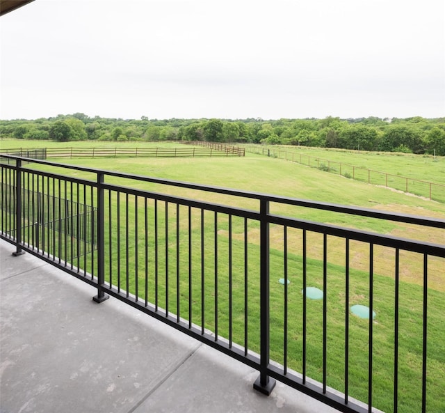 balcony featuring a rural view