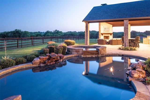 view of pool with a gazebo, an outdoor living space with a fireplace, a patio area, fence, and an in ground hot tub