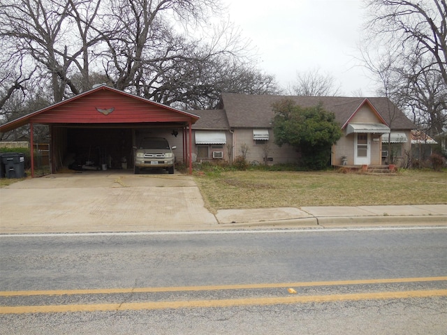 view of front of home with a garage, driveway, and a front yard