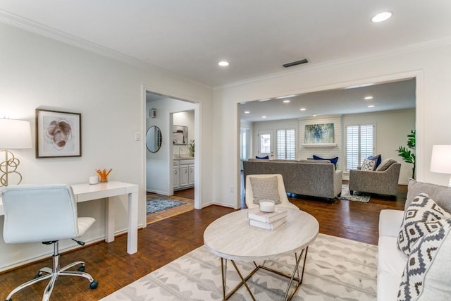 living area with ornamental molding, recessed lighting, and wood finished floors