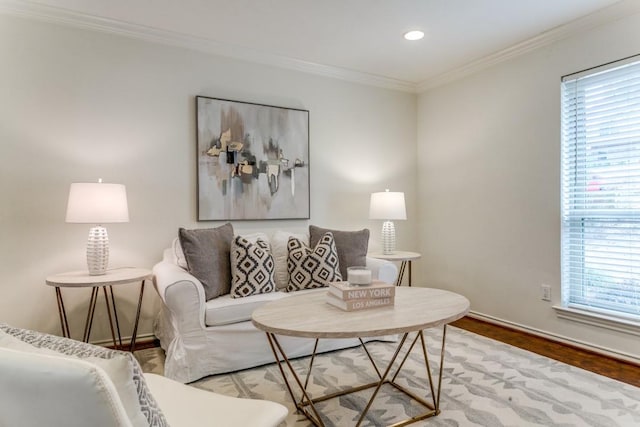 living room with baseboards, ornamental molding, wood finished floors, and recessed lighting