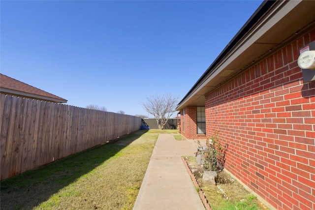 view of yard with a fenced backyard