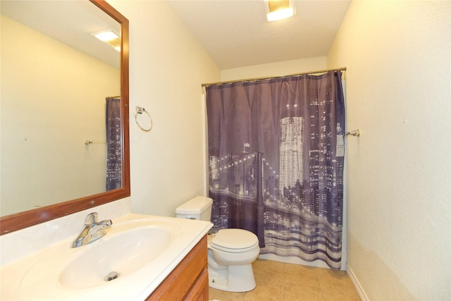 bathroom featuring curtained shower, vanity, toilet, and tile patterned floors