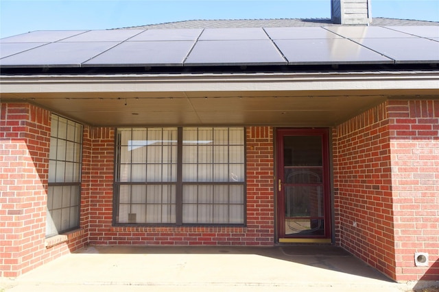 entrance to property with roof mounted solar panels