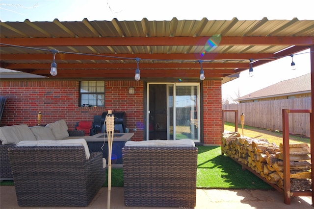 view of patio / terrace featuring fence and an outdoor living space