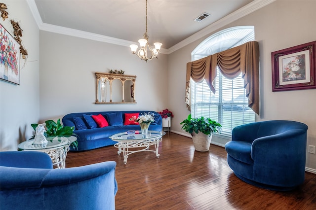 living room featuring baseboards, visible vents, ornamental molding, wood finished floors, and an inviting chandelier