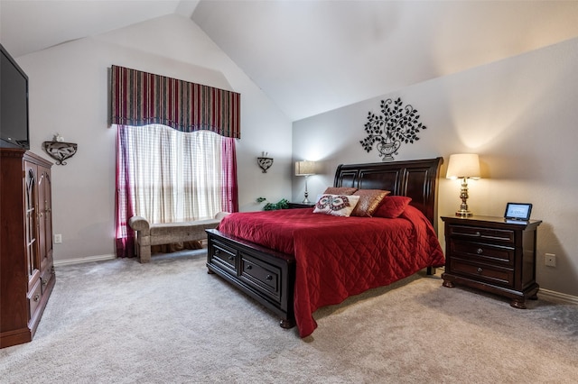 carpeted bedroom with high vaulted ceiling and baseboards