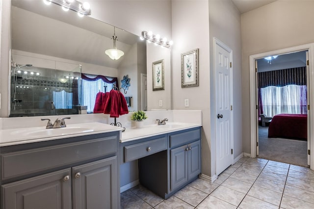 full bathroom with double vanity, a sink, and a shower stall