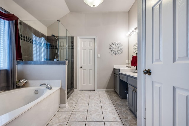 bathroom featuring lofted ceiling, a stall shower, vanity, baseboards, and a bath