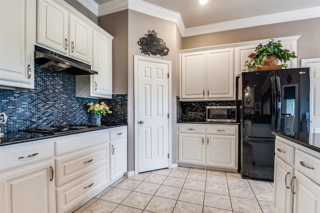 kitchen with light tile patterned floors, white cabinets, ornamental molding, under cabinet range hood, and black appliances