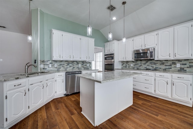 kitchen with dark wood-style floors, visible vents, appliances with stainless steel finishes, and a sink