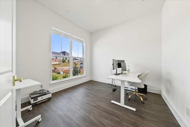 office area with baseboards and wood finished floors