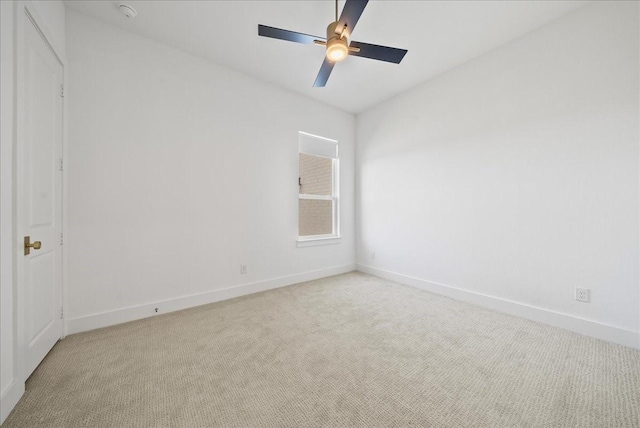 unfurnished room with ceiling fan, carpet flooring, and baseboards