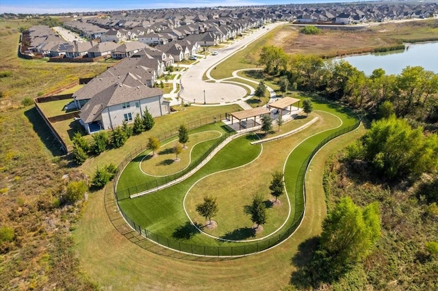 drone / aerial view with a water view and a residential view