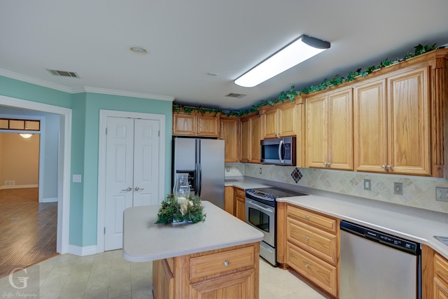 kitchen featuring stainless steel appliances, visible vents, light countertops, tasteful backsplash, and crown molding