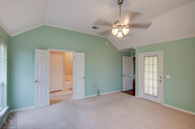 unfurnished bedroom with lofted ceiling, crown molding, visible vents, and carpet flooring