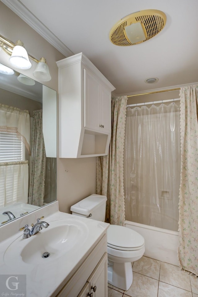 bathroom with toilet, vanity, visible vents, tile patterned floors, and crown molding