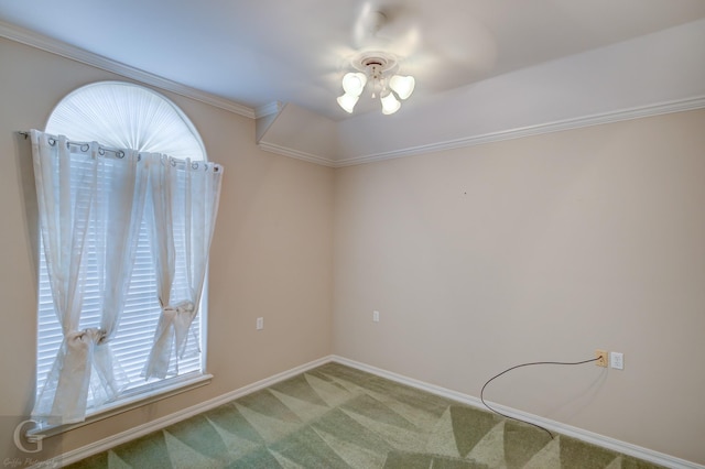 carpeted spare room with crown molding and baseboards