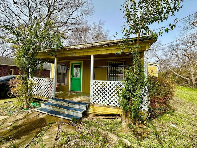 view of outbuilding featuring a porch