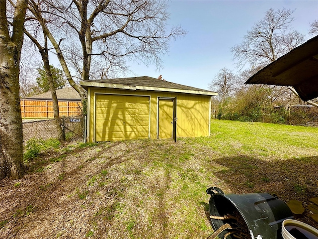 garage with fence