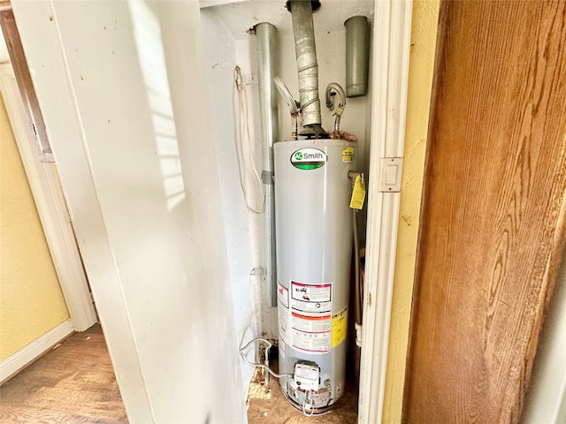 utility room featuring water heater