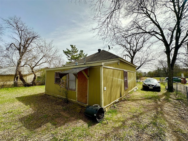 view of property exterior featuring fence