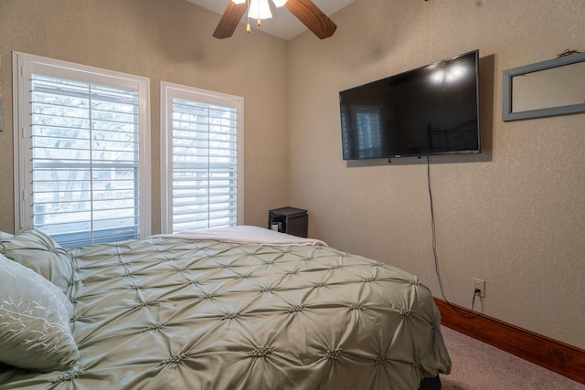 bedroom with ceiling fan and baseboards