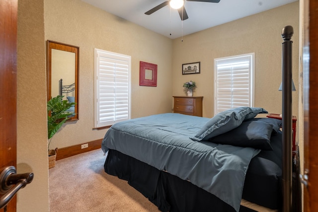 bedroom with carpet floors, a ceiling fan, and baseboards