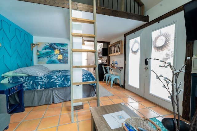 tiled bedroom with access to exterior and french doors