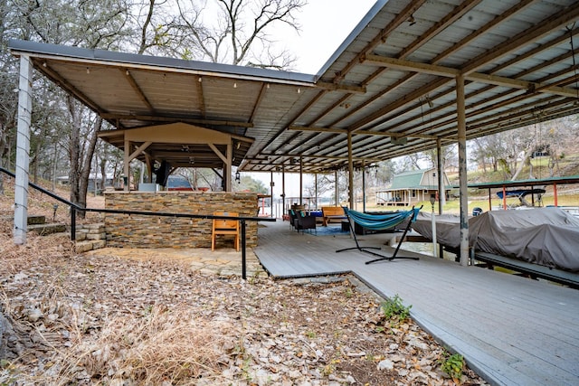 view of patio featuring a dock and boat lift