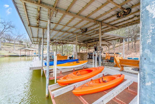 dock area featuring a water view and boat lift