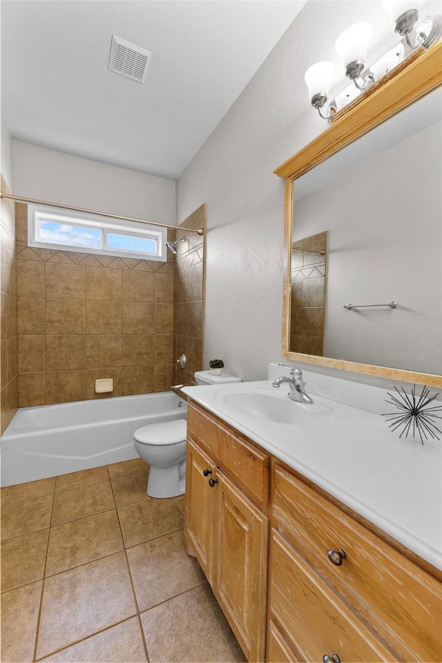 full bathroom with shower / bathtub combination, visible vents, toilet, vanity, and tile patterned flooring