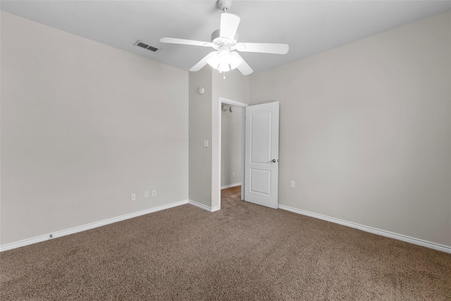 unfurnished room featuring ceiling fan, carpet, visible vents, and baseboards