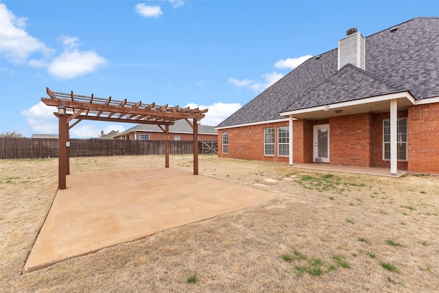 view of yard featuring a patio area, a fenced backyard, and a pergola