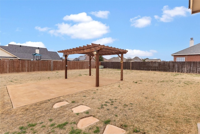 view of yard featuring a patio area, a fenced backyard, and a pergola