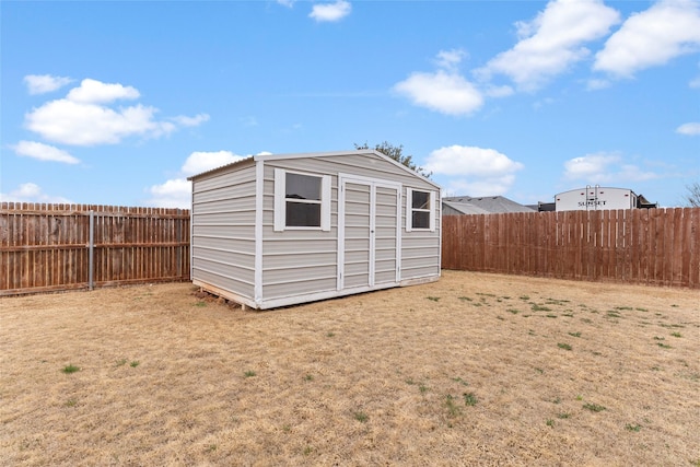 view of shed featuring a fenced backyard