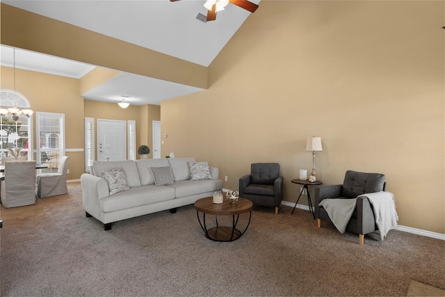 carpeted living room featuring baseboards, visible vents, high vaulted ceiling, and ceiling fan with notable chandelier