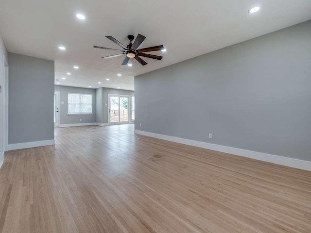 unfurnished room featuring a ceiling fan, baseboards, recessed lighting, and light wood finished floors
