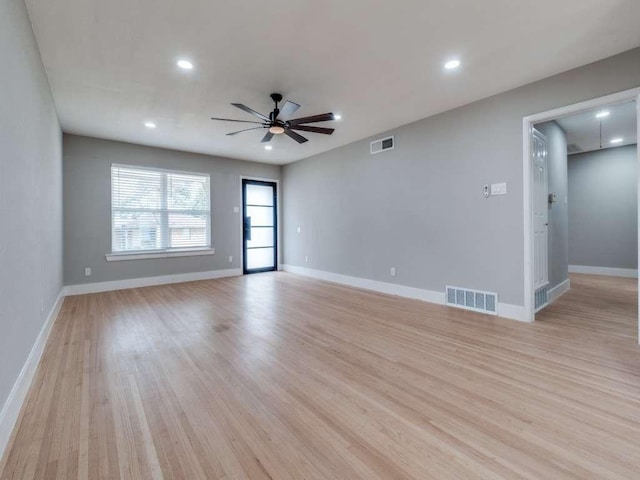 unfurnished living room featuring ceiling fan, visible vents, and light wood-style flooring