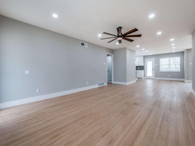 unfurnished living room featuring visible vents, a ceiling fan, recessed lighting, and light wood-type flooring