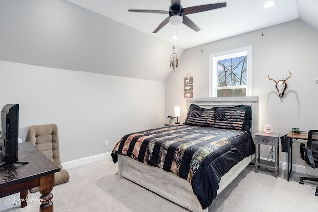 carpeted bedroom featuring lofted ceiling, baseboards, and a ceiling fan