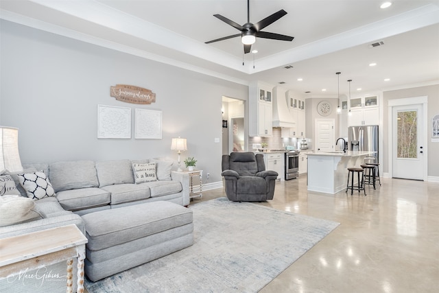 living room featuring ornamental molding, visible vents, ceiling fan, and recessed lighting
