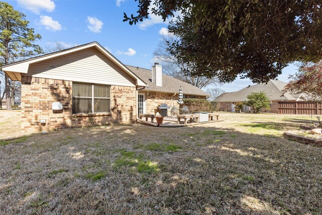 103 Holly Hill Ln, Bullard, TX 75757 - exterior space featuring brick siding, a fenced backyard, and a yard