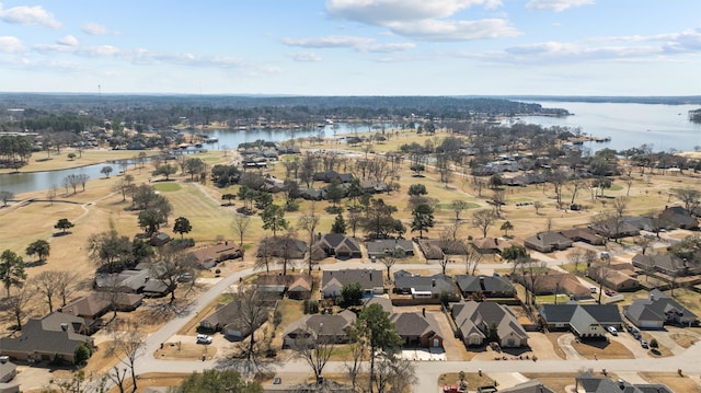 birds eye view of property featuring a residential view and a water view