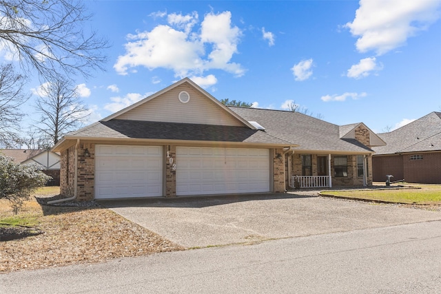 ranch-style home featuring driveway, a shingled roof, a porch, and brick siding